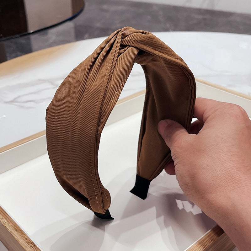 Fashionable fabric cross bow headband - Korvel