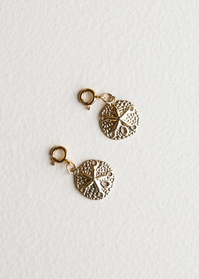 Charm en sable en or 14 carats