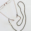 Collier de lunettes en ambre de la mer Baltique - Noir naturel