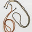 Collier de lunettes en ambre de la mer Baltique - Noir naturel