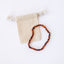 Collar con halo de ámbar báltico cognac crudo y amatista