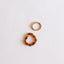 Empilement de bagues en ambre baltique cognac brut et or 14 carats