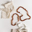 Ensemble de collier en ambre baltique cognac brut et quartz rose