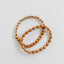 Pulsera elástica de madera de ciprés y oro de 14 quilates con sol y luna