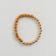 Pulsera elástica de madera de ciprés y oro de 14 quilates con sol y luna