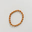 Pulsera elástica de madera de ciprés y oro de 14 quilates con sol y luna