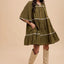 Chic Bohemian Tiered Dress with Tassel Details and Contrast Trim - Korvel