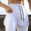 Shorts actifs pour hommes avec cordon de serrage et doublure de compression