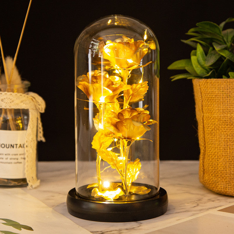 Ornement en verre avec roses en feuille d'or et lumière LED