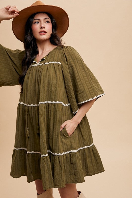 Chic Bohemian Tiered Dress with Tassel Details and Contrast Trim - Korvel