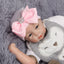 Chapeau en tricot rayé rose scintillant pour bébé avec un grand nœud