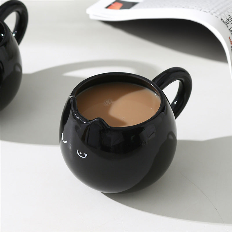 Adorable hand - painted cat - shaped ceramic mug, perfect for coffee or tea. - Korvel
