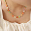Collier en fleur avec goutte d'huile en acier titane