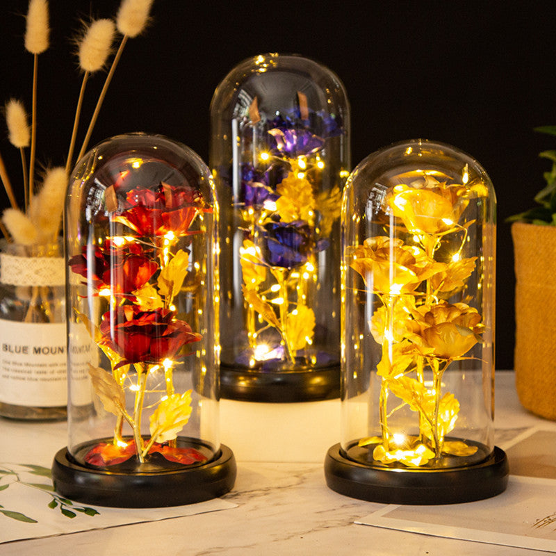 Ornement en verre avec roses en feuille d'or et lumière LED
