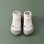 Chaussures de sol souples pour bébés avec chaussettes pour les premiers pas