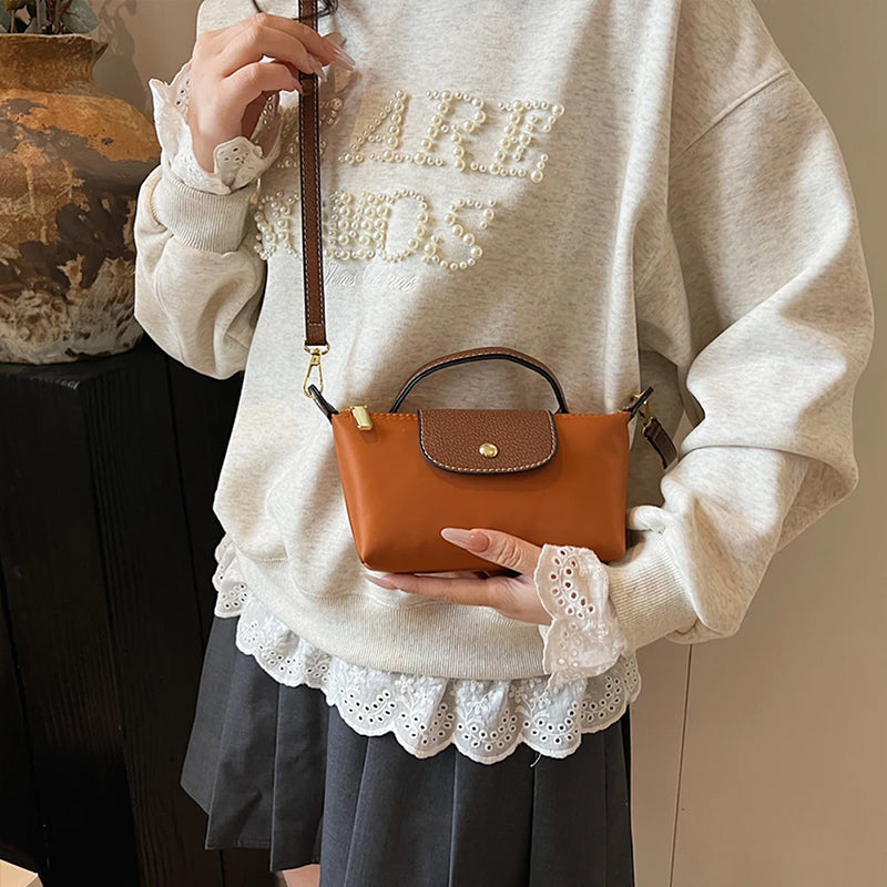 2025 Women's Mini Dumpling Handbag. Made of high - end nylon. Stylish shoulder/crossbody phone bag. - Korvel
