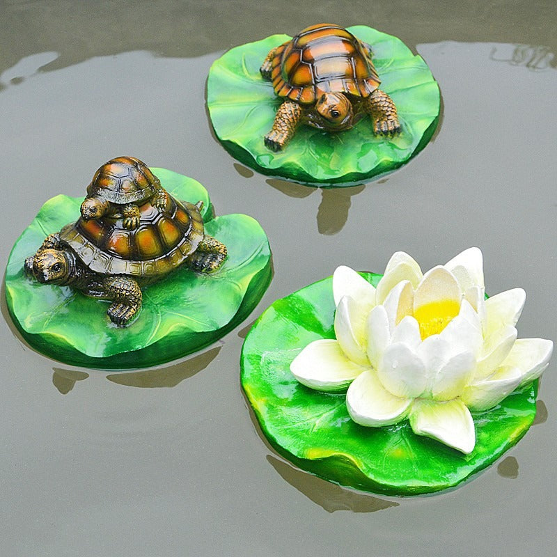 Turtle resin ornaments floating on the water surface - Korvel