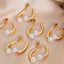 Elegant split design with high gloss pearl inlay simple titanium steel gold-plated earrings - Korvel