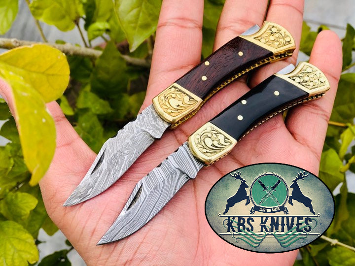 Exquisite Pair of Custom Damascus Steel Folding Pocket Knives with Elegant Rosewood and Buffalo Horn Handles - Korvel