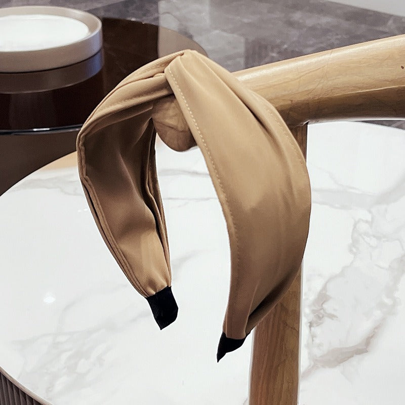 Fashionable fabric cross bow headband - Korvel