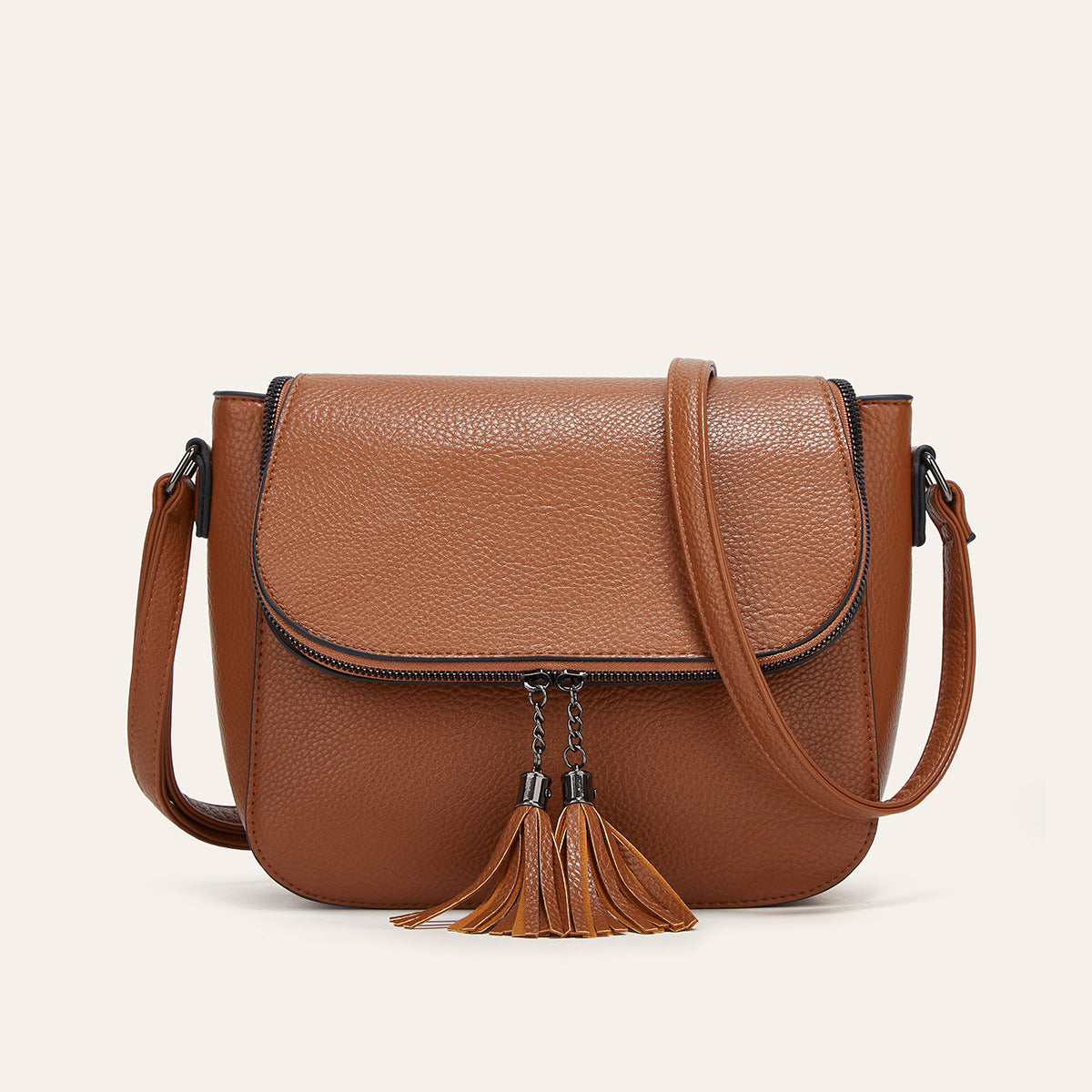 Fashionable Flip-Top Saddle Bag with Tassels