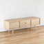 55.12" Rattan TV cabinet double sliding doors for storage adjustable shelf solid wood legs TV console for living room natural - Korvel