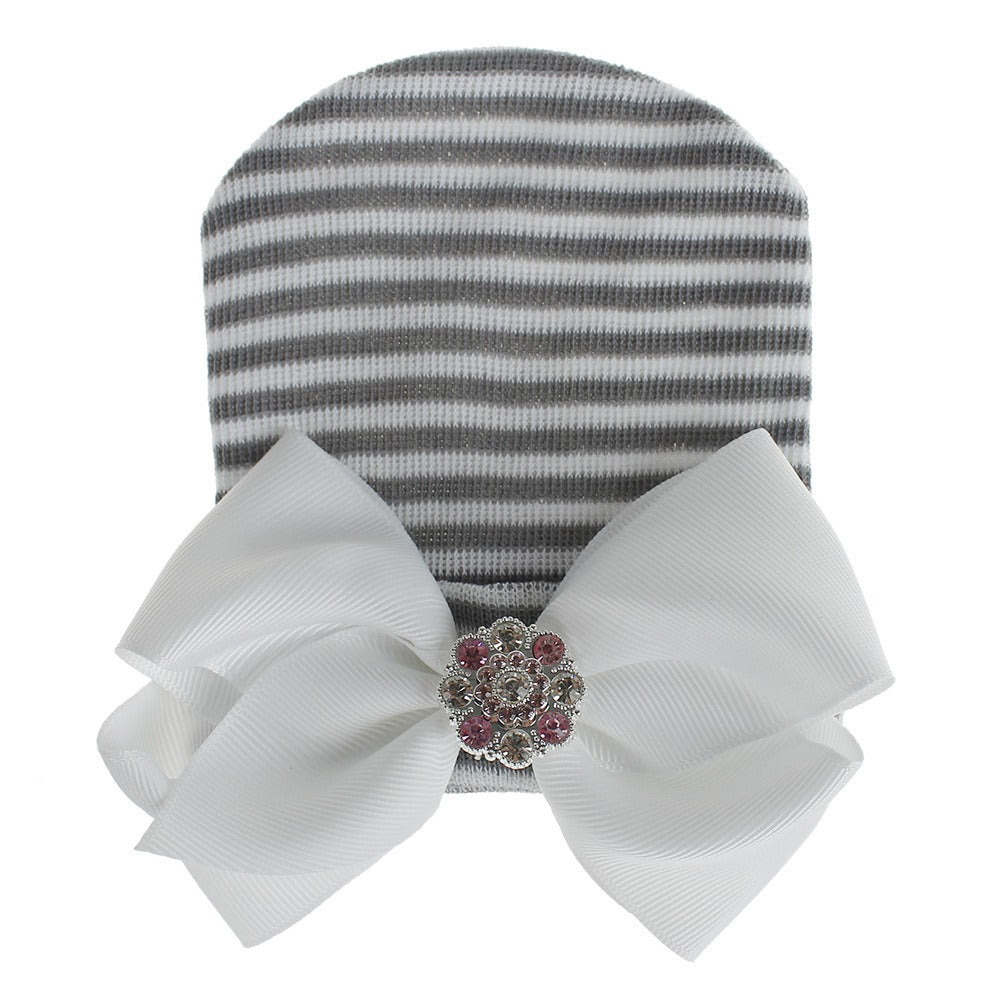 Chapeau en tricot rayé rose scintillant pour bébé avec un grand nœud