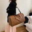 Elegante bolsa de viaje de duffel con textura de PU en colores sólidos
