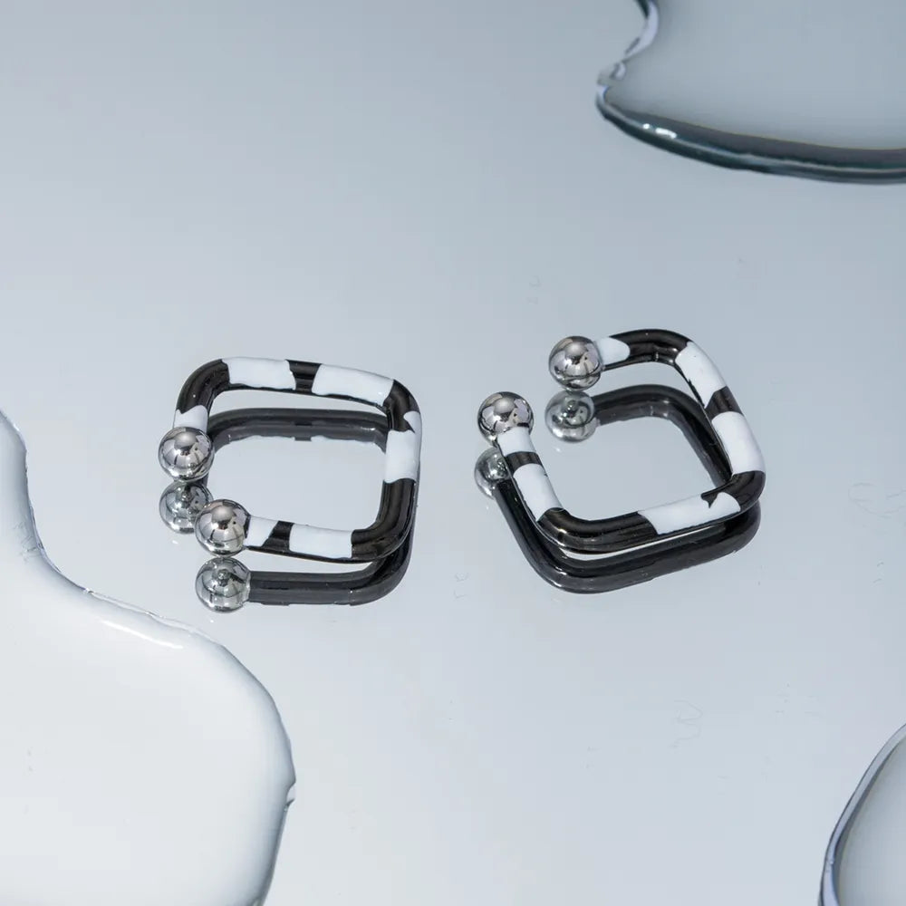 Boucles d'oreilles en acier inoxydable avec goutte d'huile