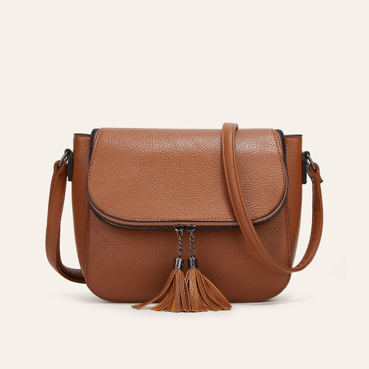 Fashionable Flip-Top Saddle Bag with Tassels