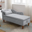 Chaise longue en velours gris avec rangement et coussin