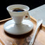 Ensemble de tasses et soucoupes à café exquisément préparées à la main
