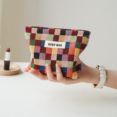Sac de rangement compact pour le maquillage et les articles sanitaires des femmes en voyage