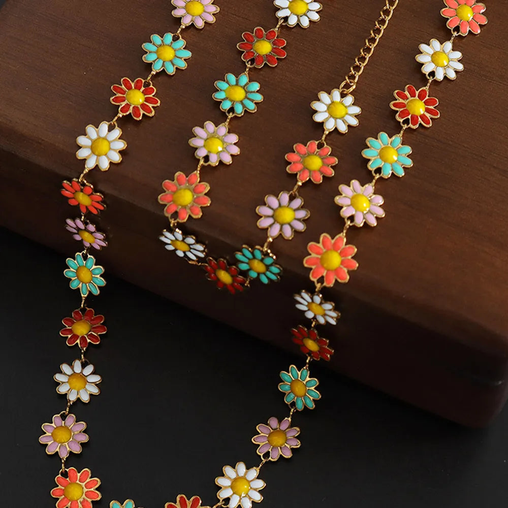 Collier en fleur avec goutte d'huile en acier titane