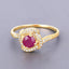 0.63 Carat Ruby and Diamond Halo Ring in 14K Yellow Gold