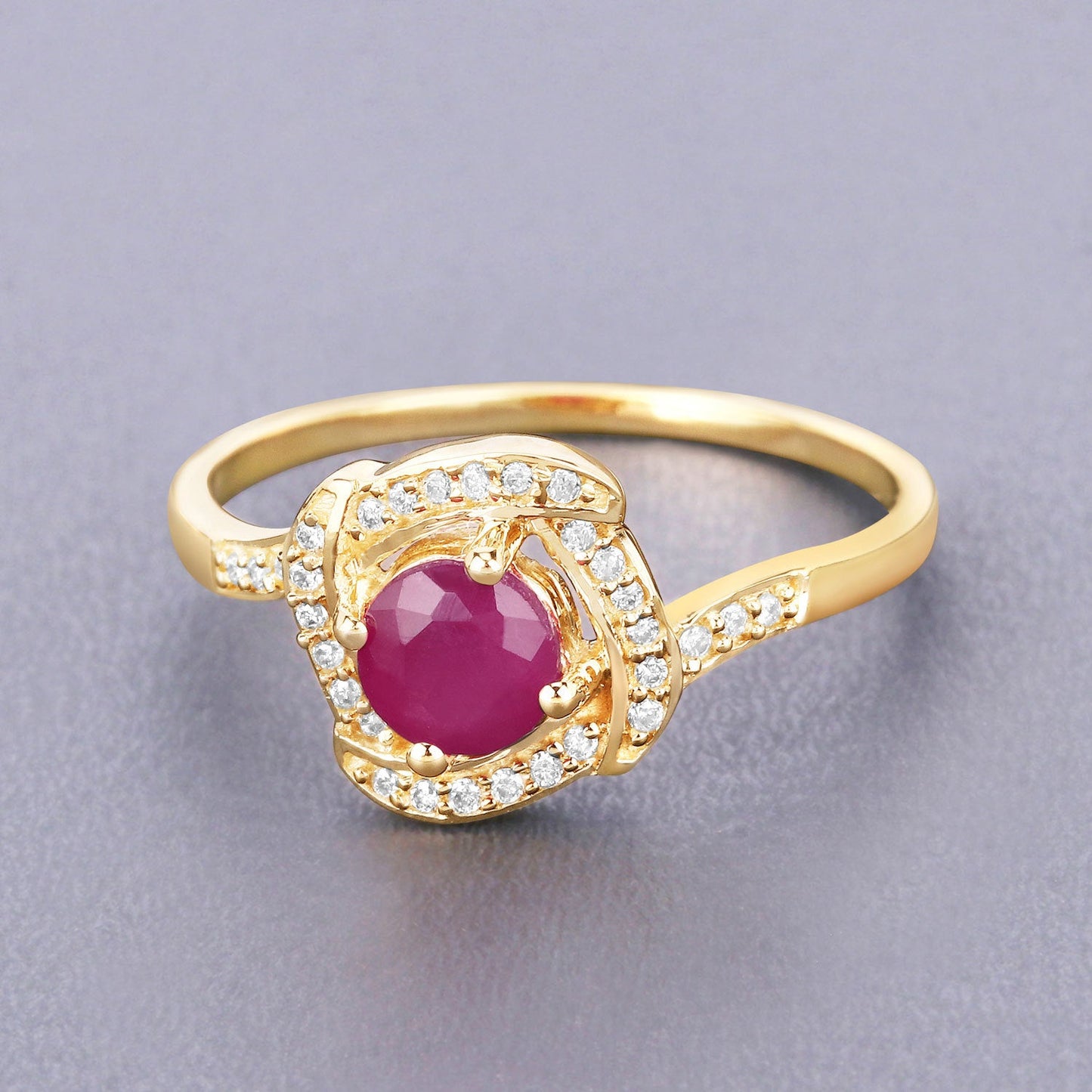 0.63 Carat Ruby and Diamond Halo Ring in 14K Yellow Gold