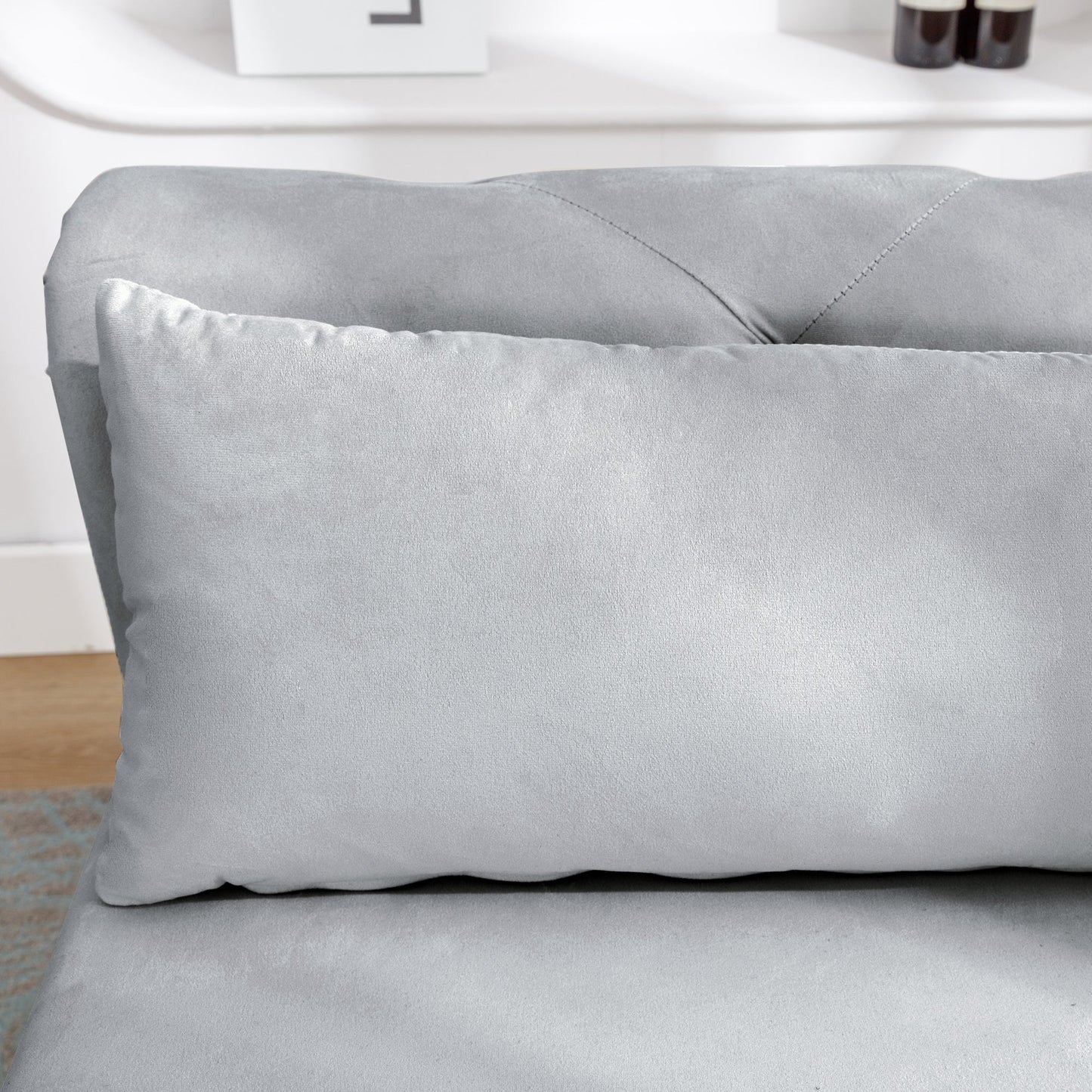 Chaise longue en velours gris avec rangement et coussin