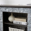 Mantel Stone modern entertainment console, manually stacked stone surrounds open storage space, gray - Korvel