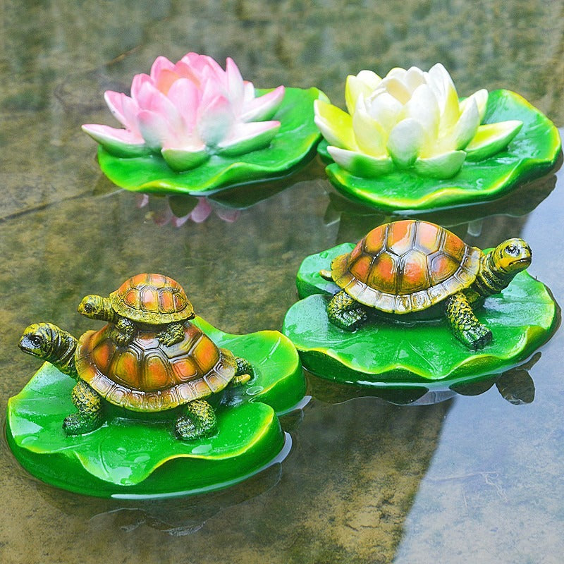 Turtle resin ornaments floating on the water surface - Korvel