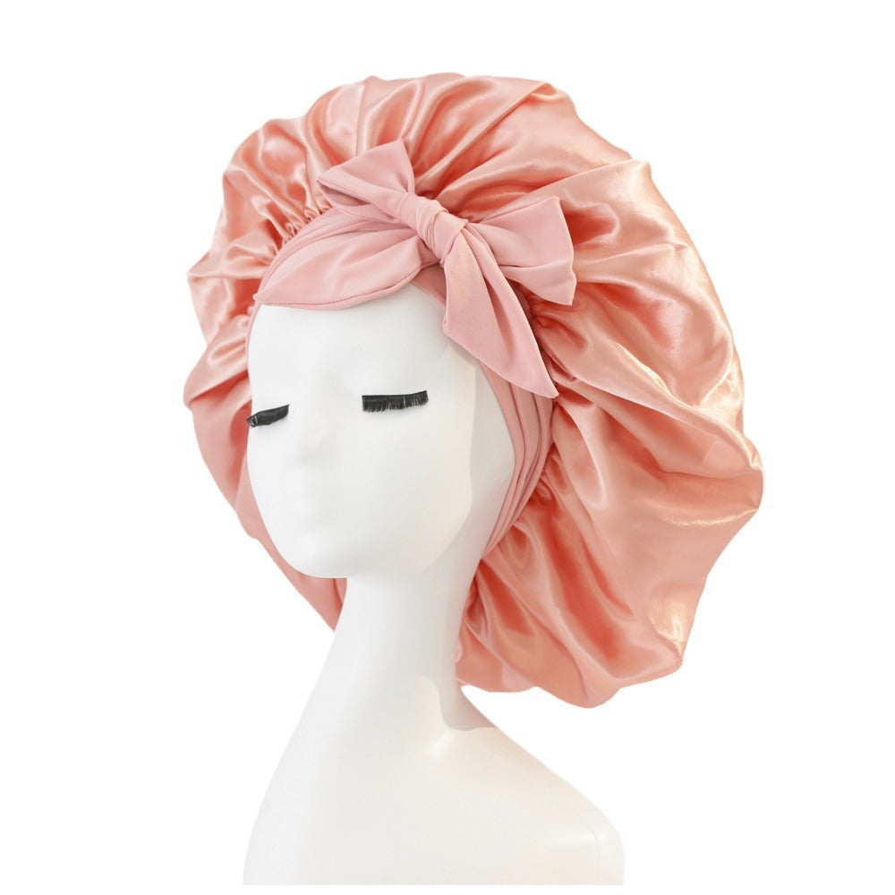 Turban élégant à large bord avec détail en nœud