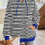 Sudadera con capucha a rayas suelta y casual