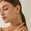 Pendientes de Stud de Sol de Acero Inoxidable Baño en Oro de 18K