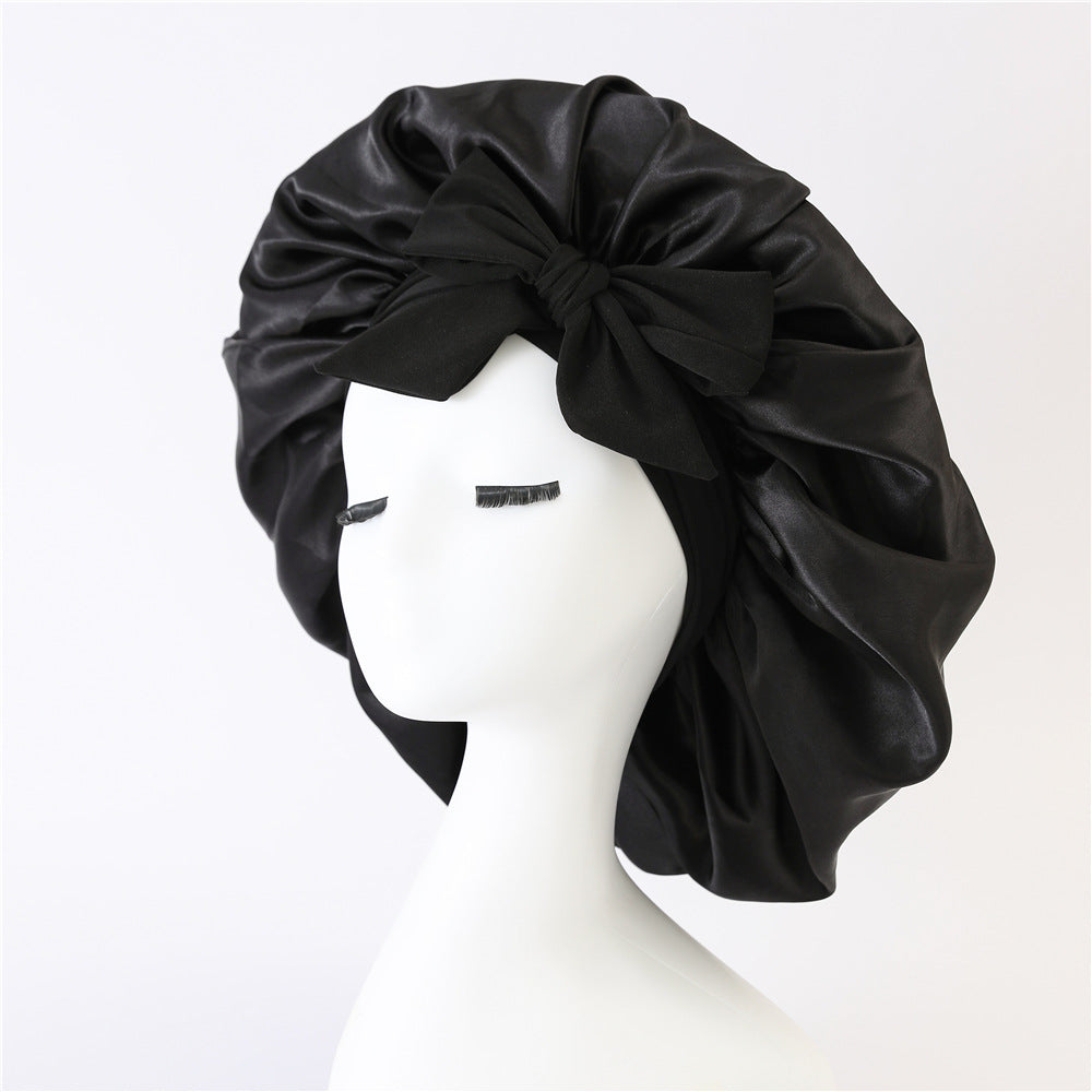 Turban élégant à large bord avec détail en nœud