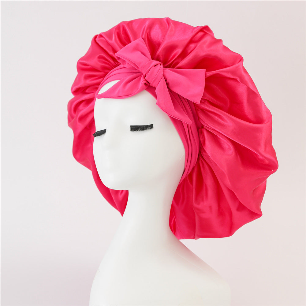 Turban élégant à large bord avec détail en nœud