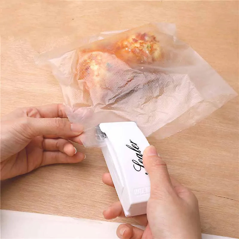 Mini sealing machine small household plastic sealing machine snack moisture-proof sealing machine - Korvel