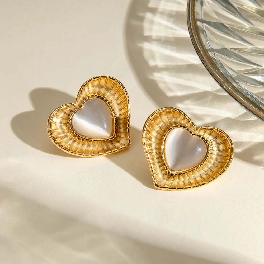 White cat eye stone earrings with niche temperament titanium steel earrings - Korvel