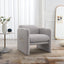 Armchair with wavy armrests, metal decorations on both sides of the armrests, made of Teddy cloth, light gray - Korvel
