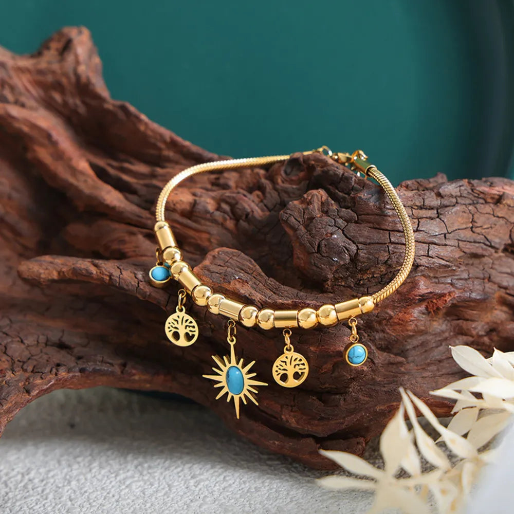 Pulsera de encanto de acero de titanio chapado en oro