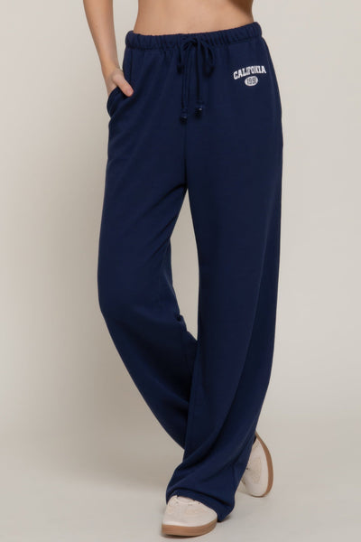 Pantalons de survêtement avec détail imprimé à la taille