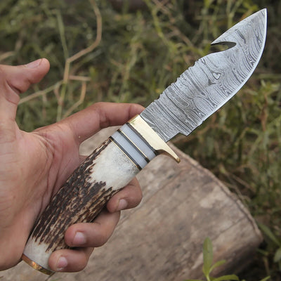 Artisan Crafted Damascus Steel Guthook Skinning Knife – 9" Stag Horn Handle with Brass Guard & Leather Sheath - Korvel